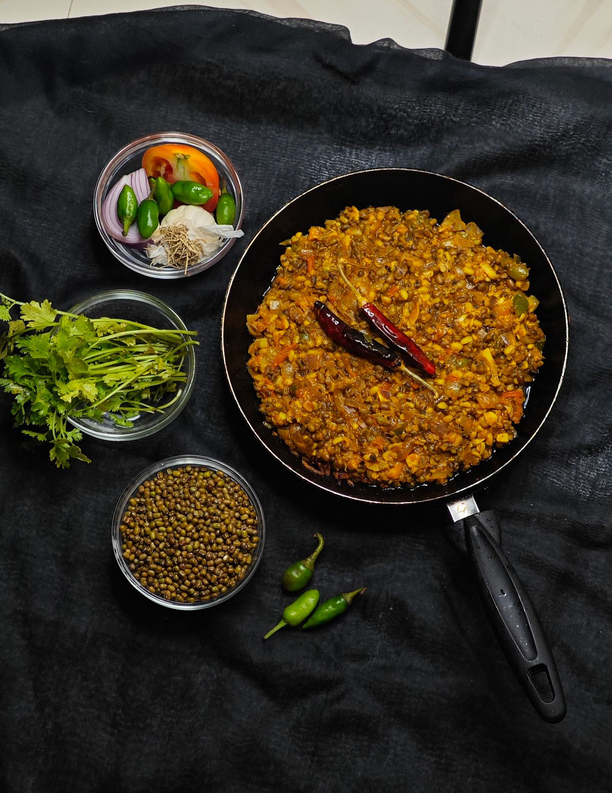 A bowl of Indian dal with fresh herbs and spices