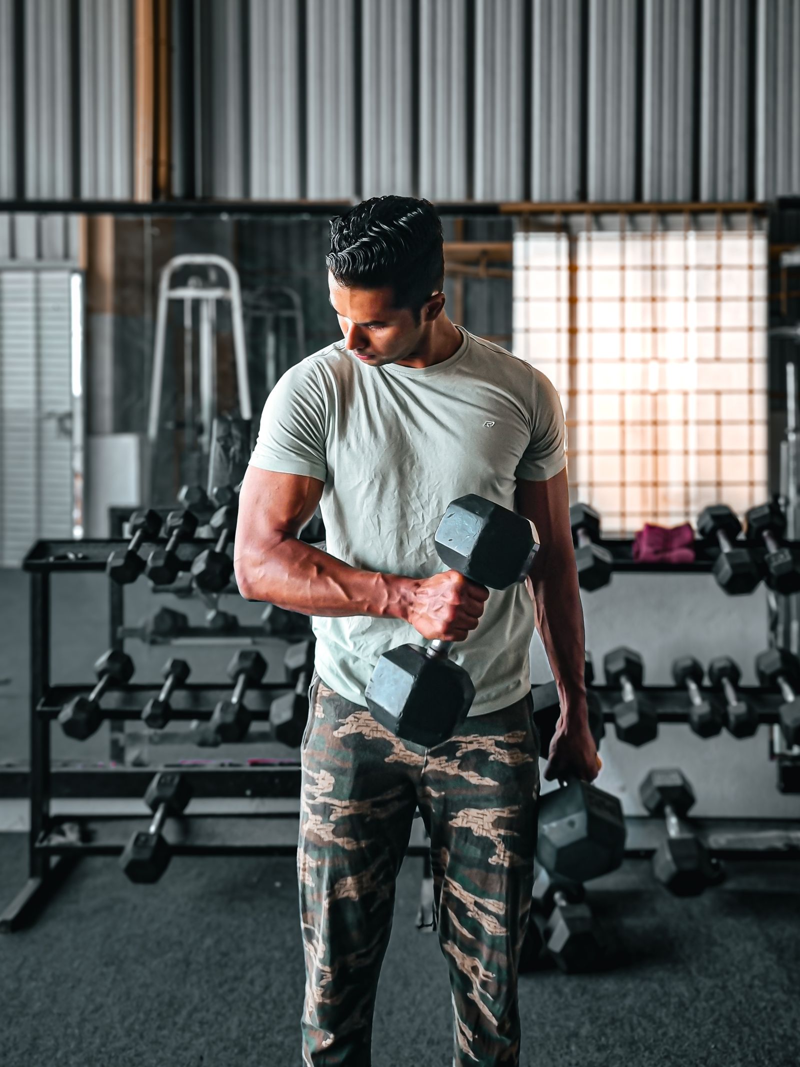 Indian athlete training with dumbbells